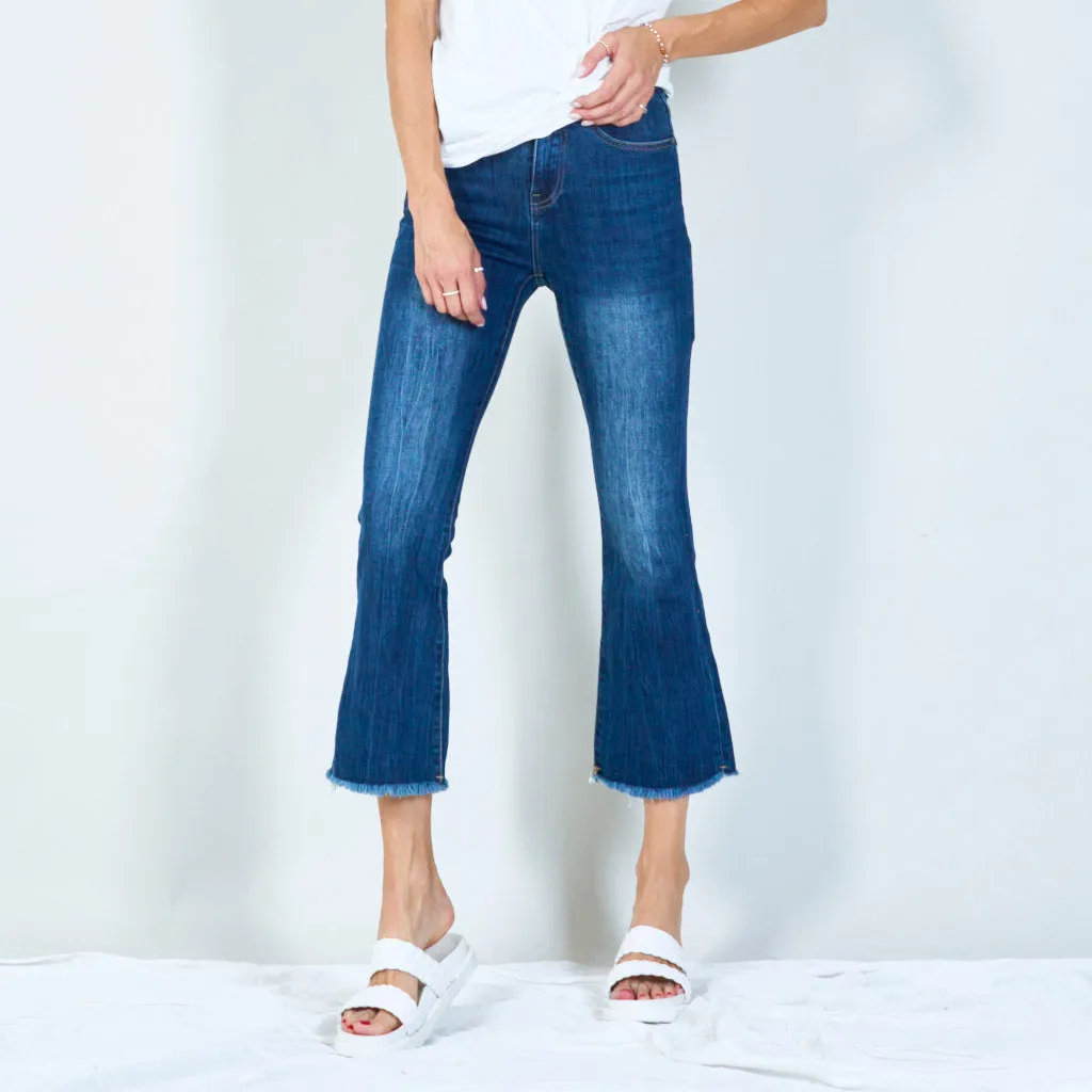 Trendy high-waisted flared jeans with raw hem wholesale
